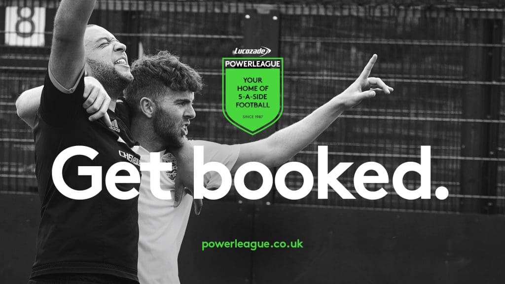 Powerleague advert. Black and white photograph of two male friends with their arms around each others shoulders celebrating. The text overlay reads 'Get booked.'.